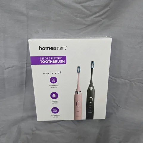 BOXED AND SEALED HOMESMART SET OF 2 ELECTRIC TOOTHBRUSHES – PINK & BLACK