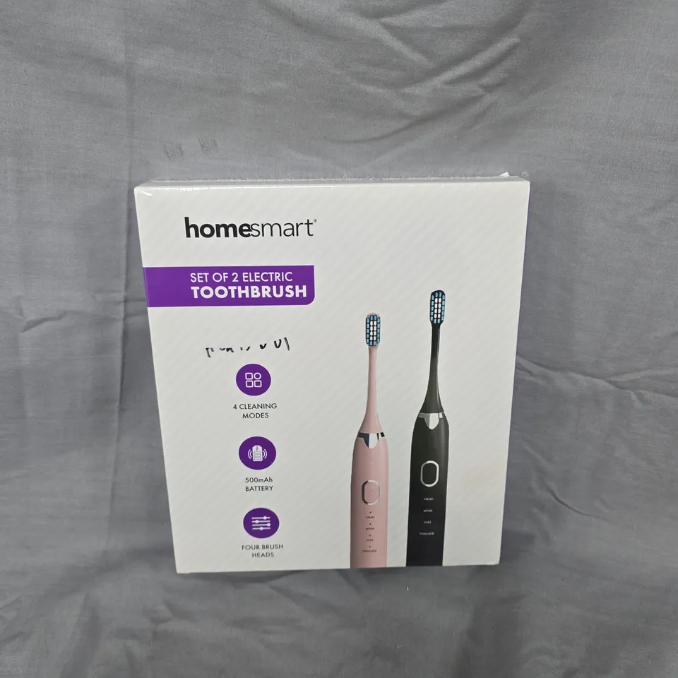 BOXED AND SEALED HOMESMART SET OF 2 ELECTRIC TOOTHBRUSHES – PINK & BLACK