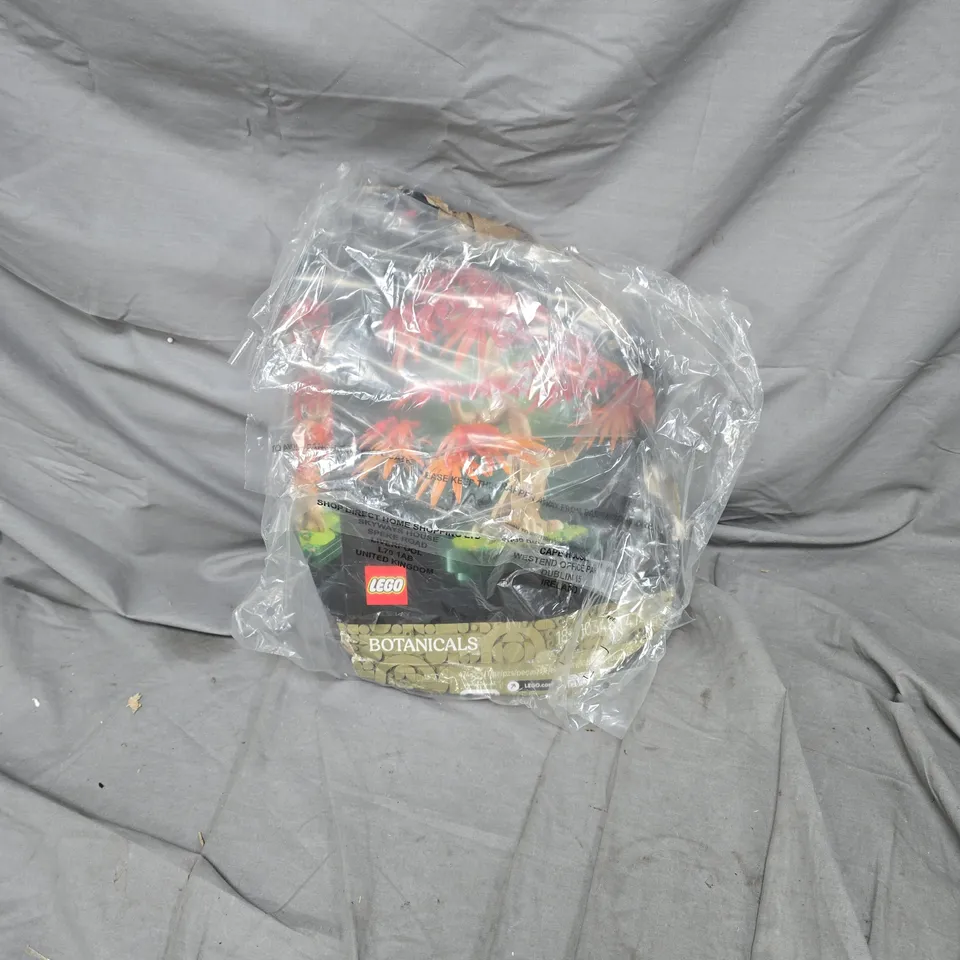 CAGE OF APPROXIMATELY 8 ASSORTED HOUSEHOLD ITEMS INCLUDING HISENSE MICROWAVE AND LEGO BOTANICALS