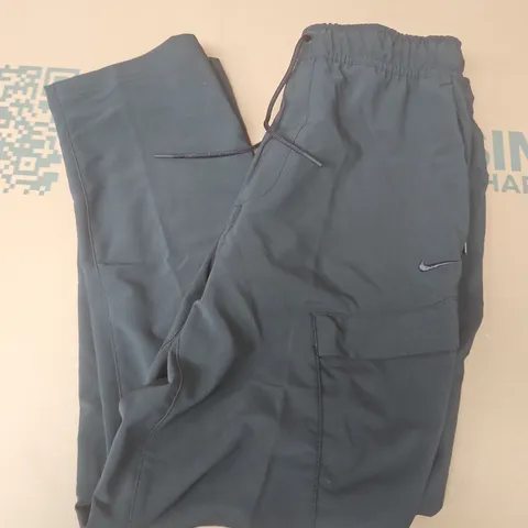 NIKE UNLIMITED TRACKSUIT BOTTOM IN BLACK - MEDIUM