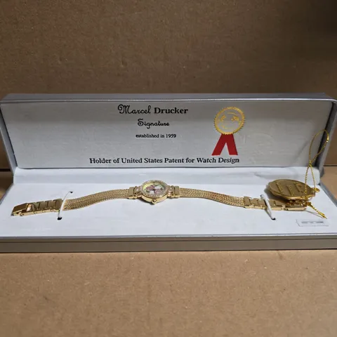 MARCEL DRUCKER GOLD TONE WRISTWATCH WITH FLORAL FACE