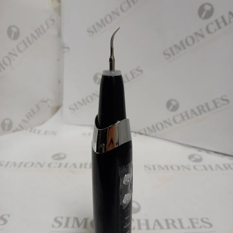 BOXED ULTRASONIC ELECTRONIC INTELLIGENT TOOTH CLEANER.