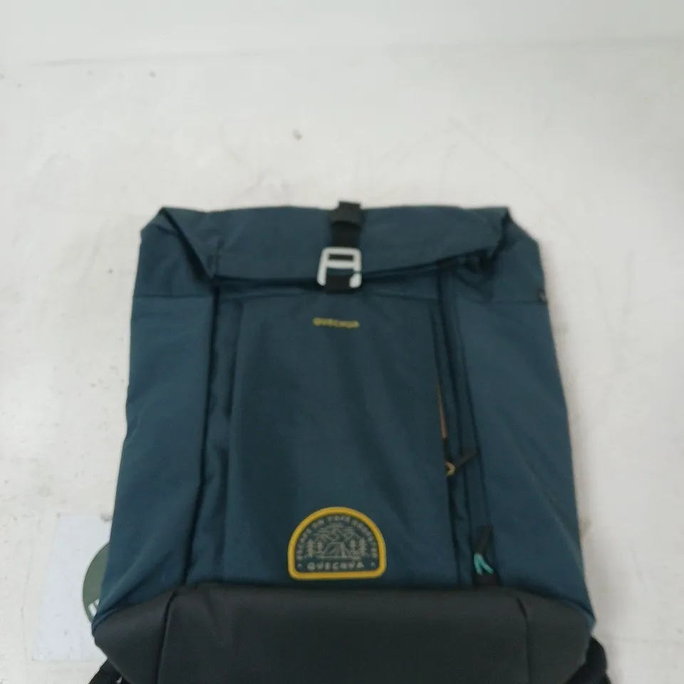 BLUE BACKPACK WITH YELLOW CIRCULAR LOGO PATCH AND BUCKLE-FLAP CLOSURE