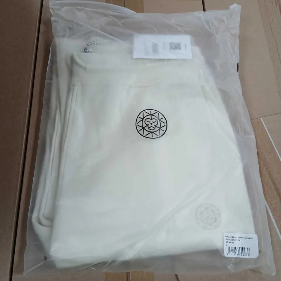 APPROXIMATELY ELEVEN PAIRS OF BRASS MONKEY OFF WHITE JOGGERS