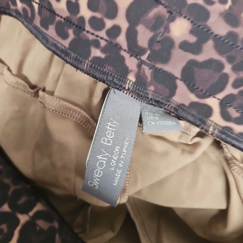 SWEATY BETTY EXPLORER WIDE LEG TAPED 32" TROUSERS IN BROWN WILD LEOPARD PRINT - MEDIUM