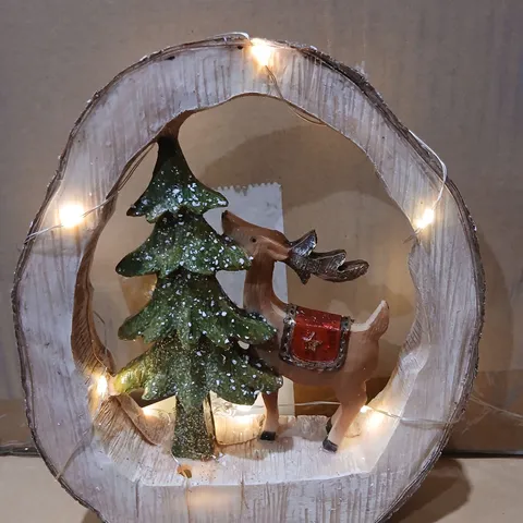 FOUR GISELA GRAHAM WOODEN CIRCULAR LED CHRISTMAS SCENE ORNAMENT – REINDEER AND TREE