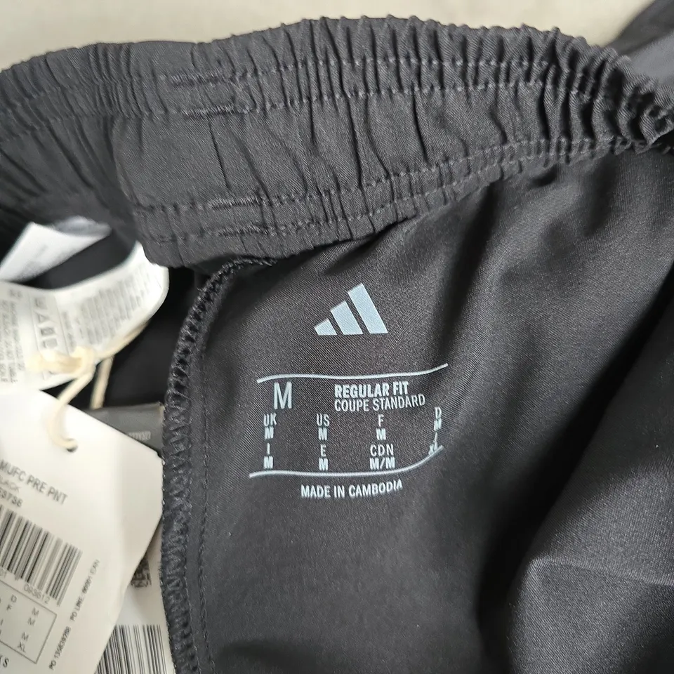 MANCHESTER UNITED ADIDAS TRACK PANTS – BLACK WITH RED STRIPE, MEN'S SIZE M