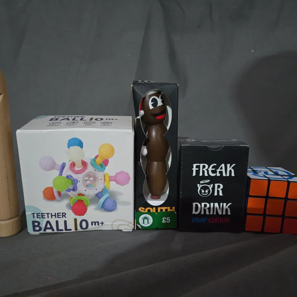 BOX OF APPROX 12 ASSORTED TOYS TO INCLUDE - FREAK OR DRINK , RUBIX CUBE , SOUTH PARK MR HANKEY PEN ETC