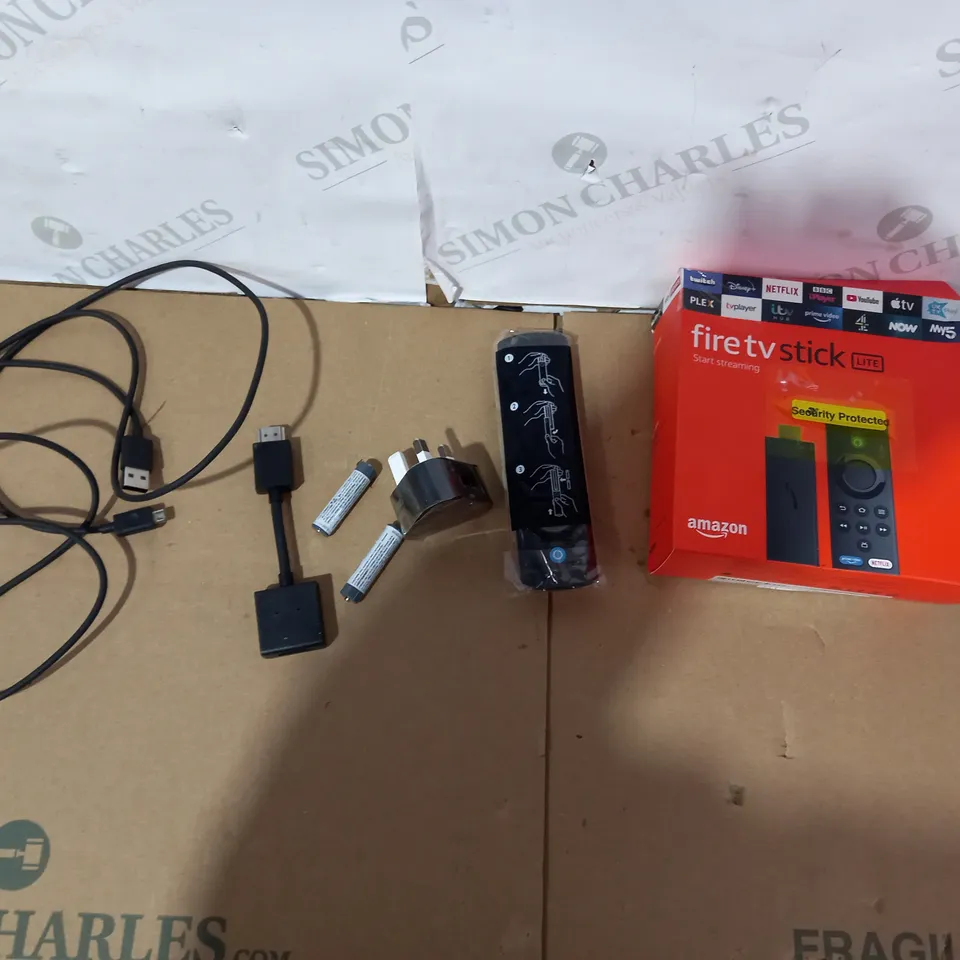 BOXED AMAZON FIRE TV STICK LITE REMOTE AND CABLES (STICK NOT INCLUDED)