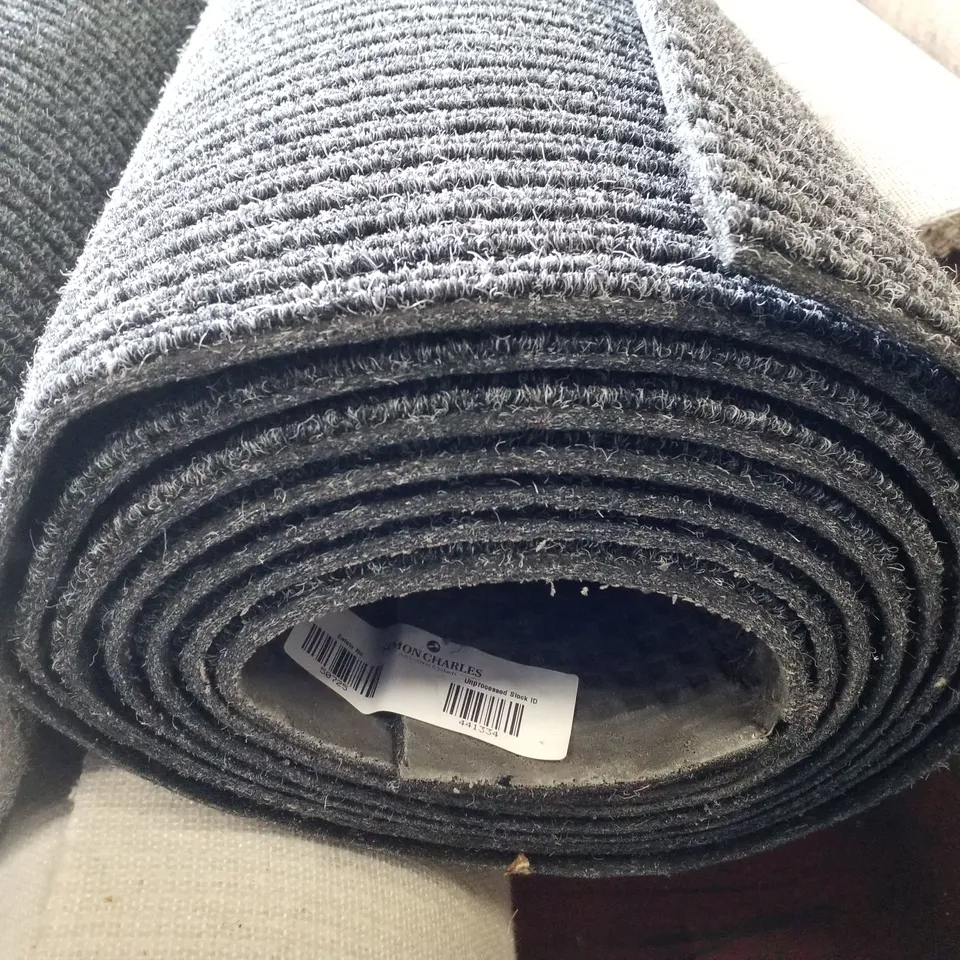 ROLL OF QUALITY LOOP PILE CARPET IN BLACK/WHITE - SIZE UNSPECIFIED