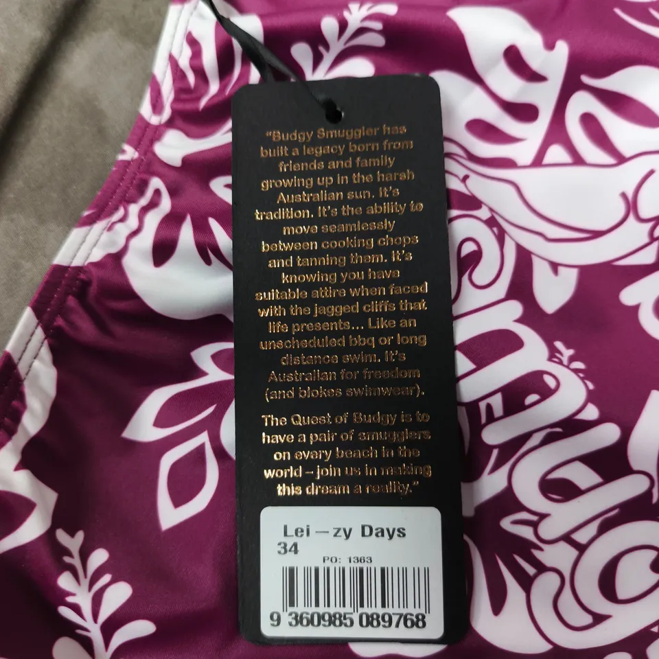 BUDGY SMUGGLERS MEN’S SWIM BRIEFS – PURPLE HIBISCUS PRINT, SIZE 34