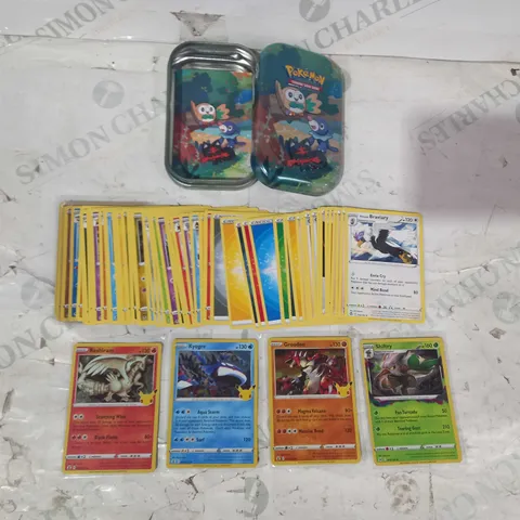 lot of assorted POKΓMON TRADING CARDS W. TIN