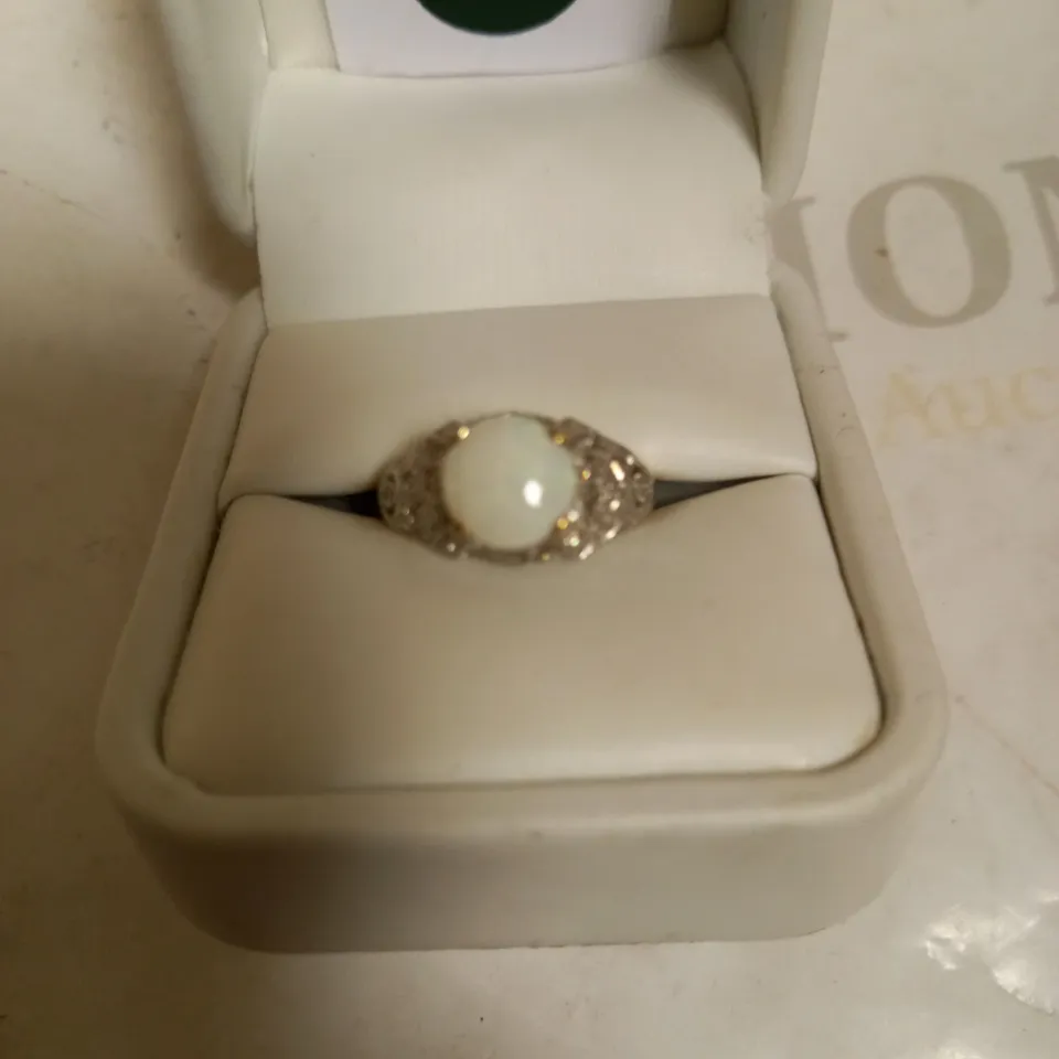 9CT YELLOW GOLD OPAL DRESS RING WITH DIAMOND ACCENTS, TOTAL WEIGHT +0.79CT