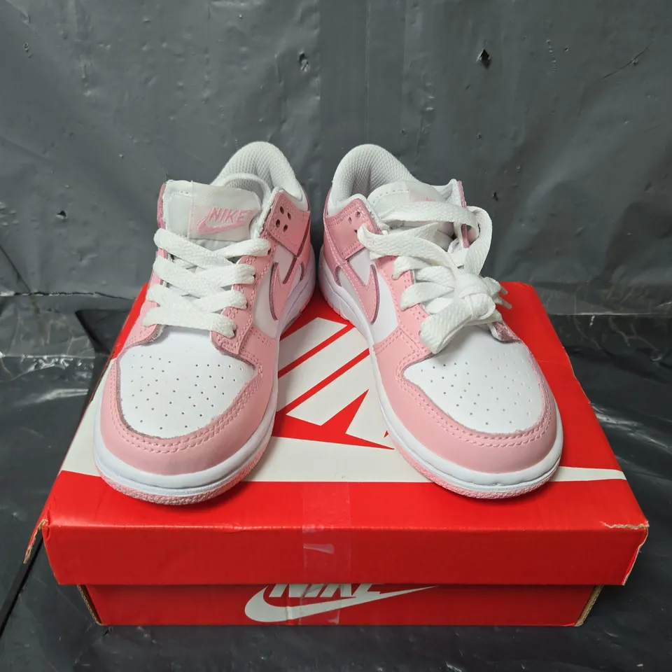 BOXED PAIR OF NIKE CHILDRENS DUNK LOW TRAINERS IN PINK/WHITE - UK 10