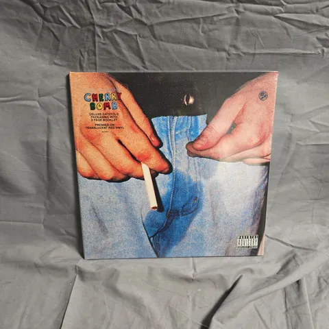CHERRY BOMB - TYLER THE CREATOR DELUXE GATEFOLD VINYL LP WITH 8-PAGE BOOKLET (TRANSLUCENT RED VINYL)