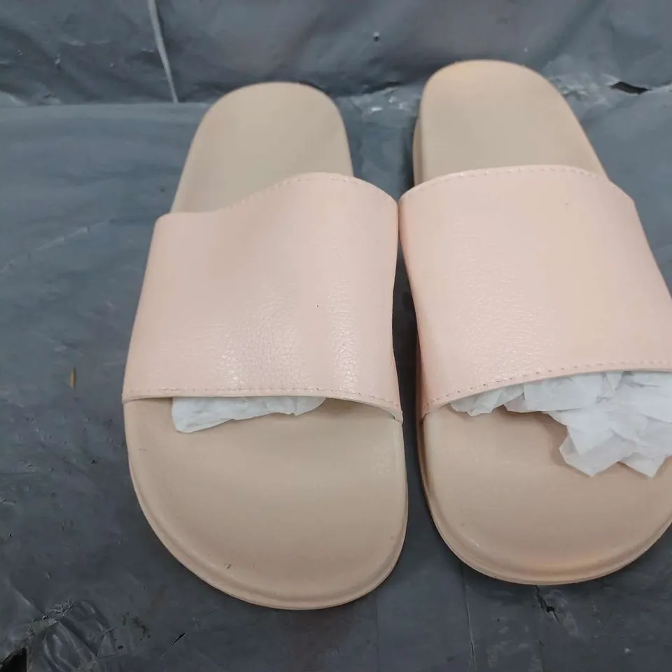 APPROXIMATELY 12 A SLIP ON SLIDERS IN PINK IN VARIOUS SIZES