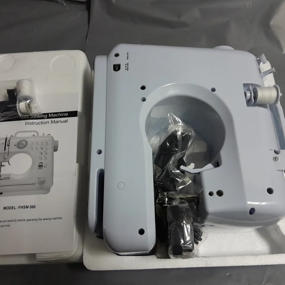 BOXED SILVER 12-STITCH MINI SEWING MACHINE