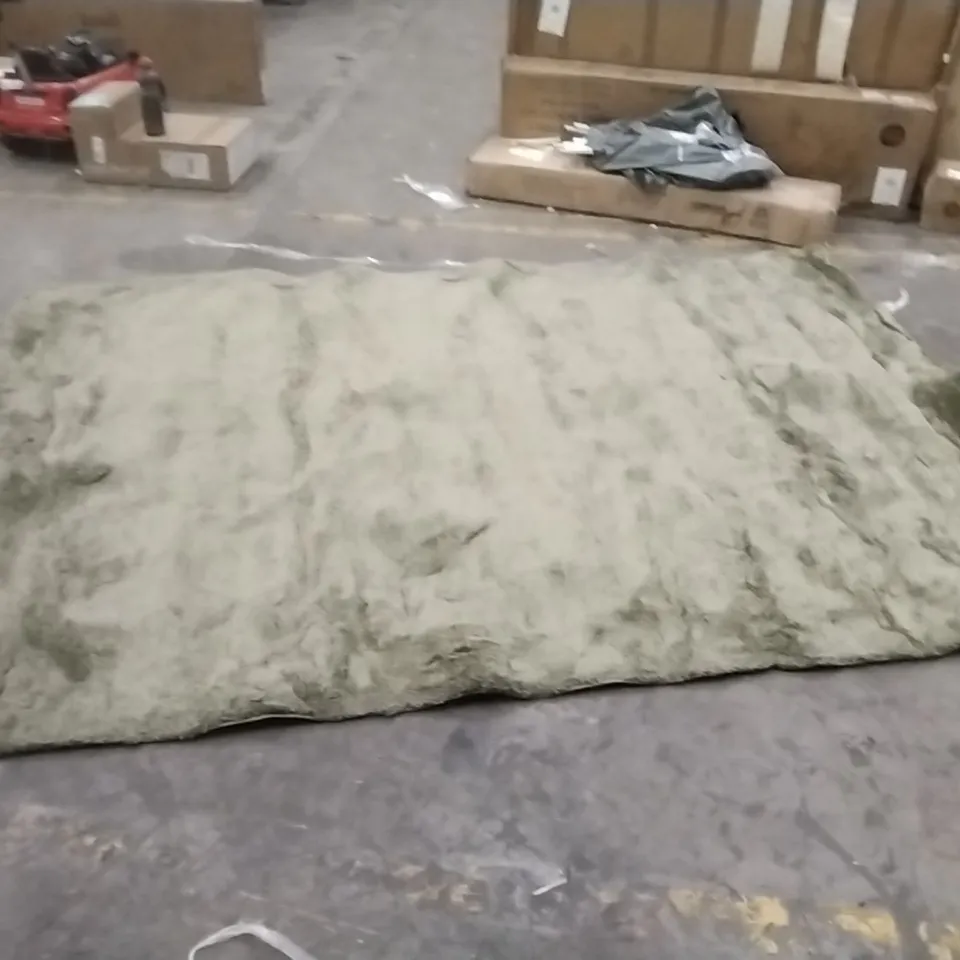 STILLAGE OF APPROXIMATELY 30 DESIGNER RUGS