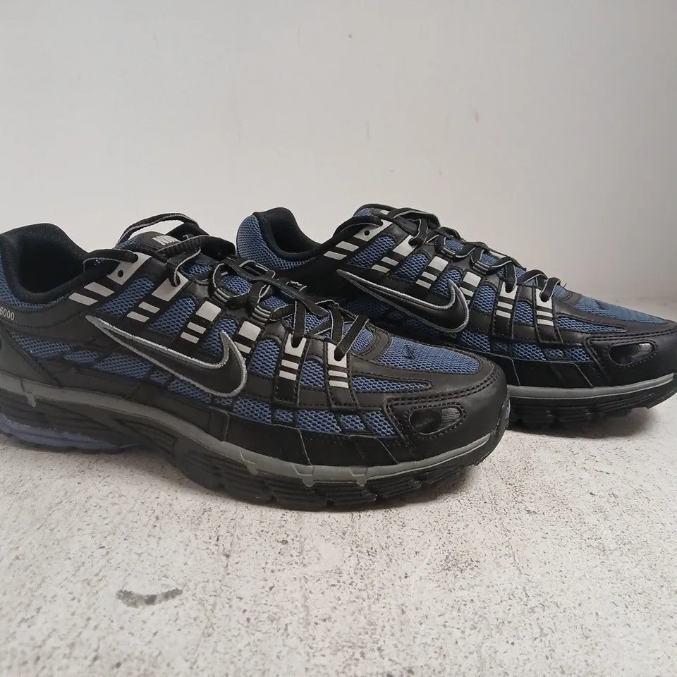 PAIR OF NIKE P-6000 TRAINERS IN BLUE/BLACK SIZE UK 9.5