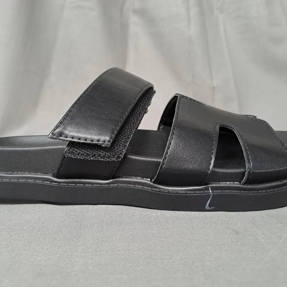 BOXED PAIR OF DESIGNER OPEN TOE FLAT SANDALS IN BLACK EU SIZE 36