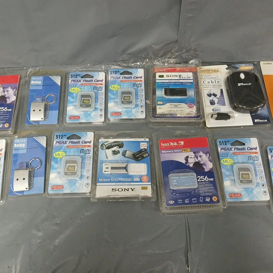 APPROXIMATELY 50 PACKAGED ELECTRICAL GOODS TO INCLUDE PEAK FLASH CARDS, MEMORY STICKS, AND SIM CARD BACK UPS ETC. 