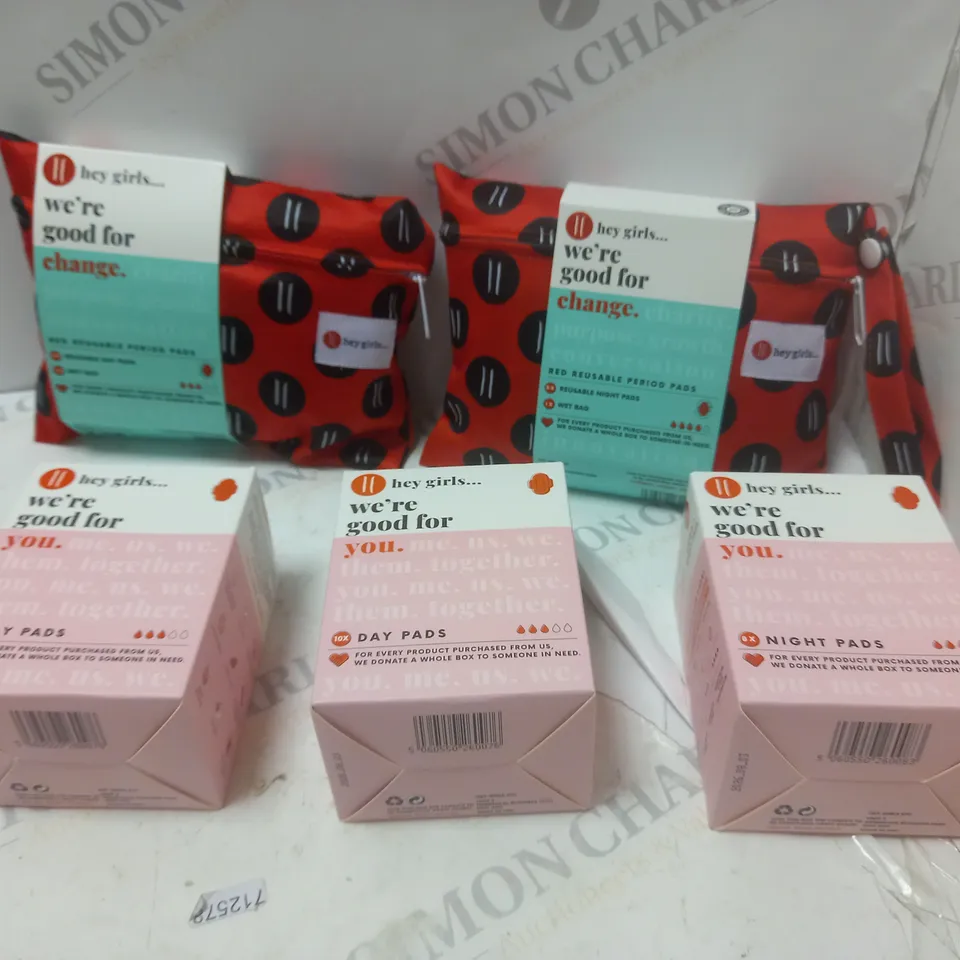 BOX OF HEY GIRLS PRODUCTS TO INCLUDE RED REUSABLE PADS, ETC