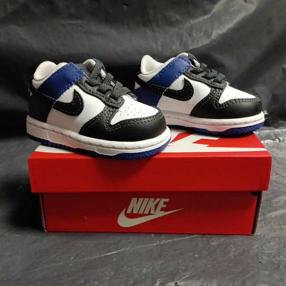 BOXED PAIR OF NIKE DUNK LOW INFANT TRAINERS IN WHITE/BLACK/BLUE SIZE UK 2.5