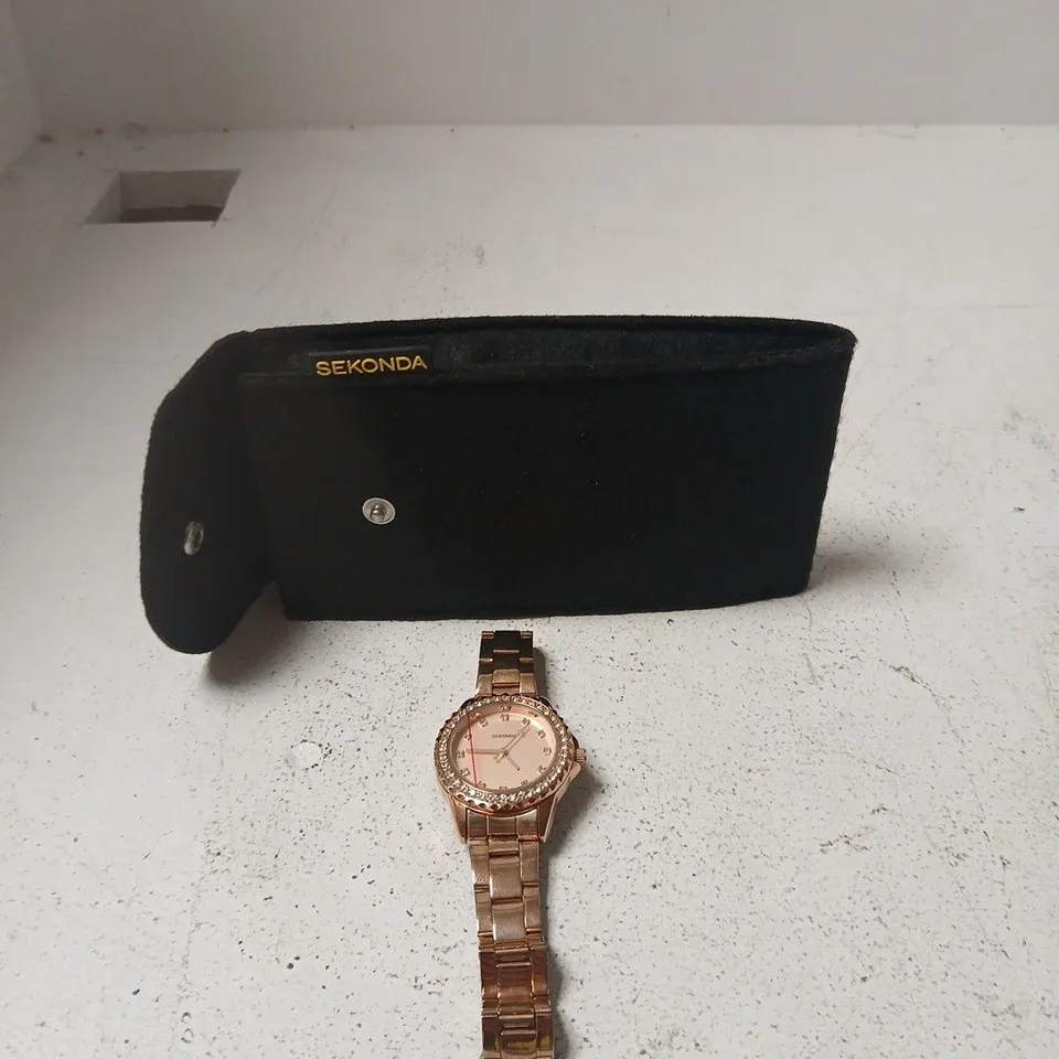 SEKONDA LADIES ROSE GOLD-TONE WATCH WITH CRYSTAL BEZEL – INCLUDES POUCH