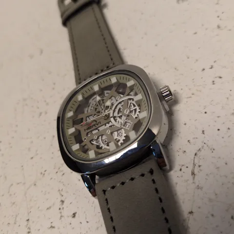 HERRYI SKELETON DIAL STAINLESS STEEL WRISTWATCH – GREY LEATHER STRAP