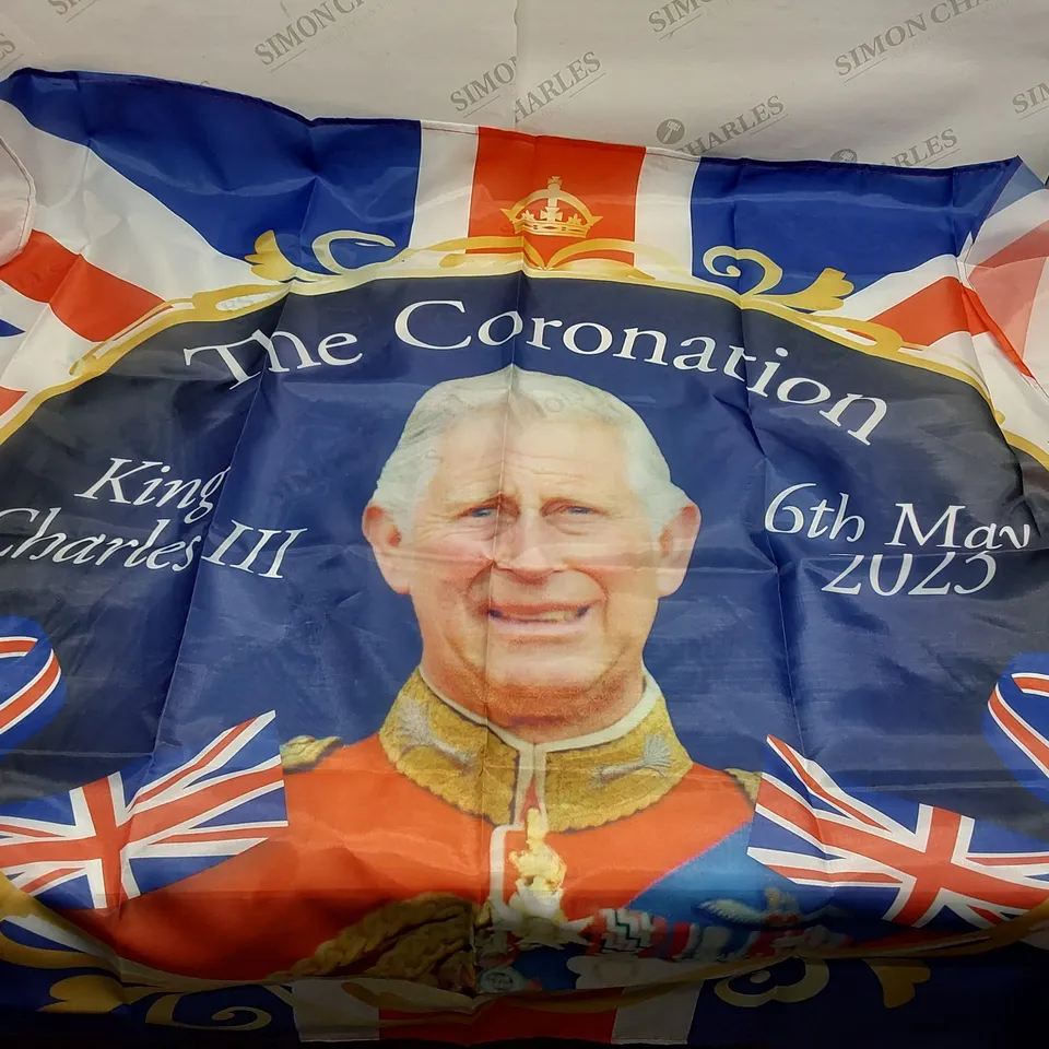 BOX OF APPROXIMATELY 12 BRAND NEW KING CHARLES 3FT X 5FT CORONATION FLAGS