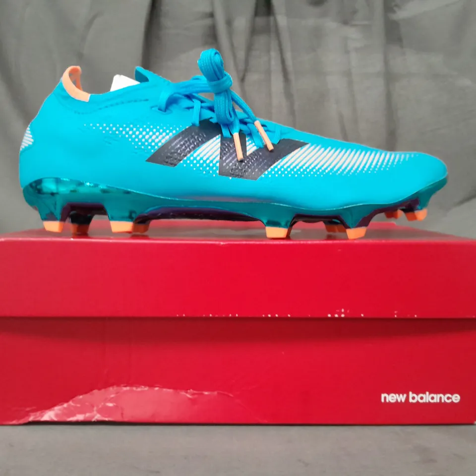 BOXED PAIR OF NEW BALANCE FURON FOOTBALL BOOTS IN SKY BLUE/ORANGE UK SIZE 10.5