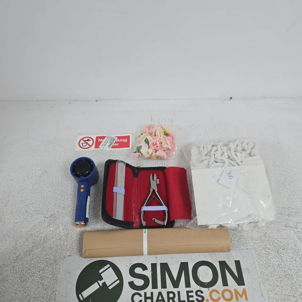 TOTE OF APPROXIMATELY 8 ASSORTED ITEMS INCLUDING PAPER BAGS, BAKING PAPER AND FAKE ROSES