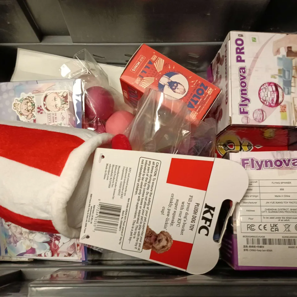 APPROXIMATELY 10 ASSORTED TOYS & GAMES PRODUCTS TO INCLUDE UNO NO MERCY GAME, MINI ZOLTAR, KFC DOG TOY, ETC