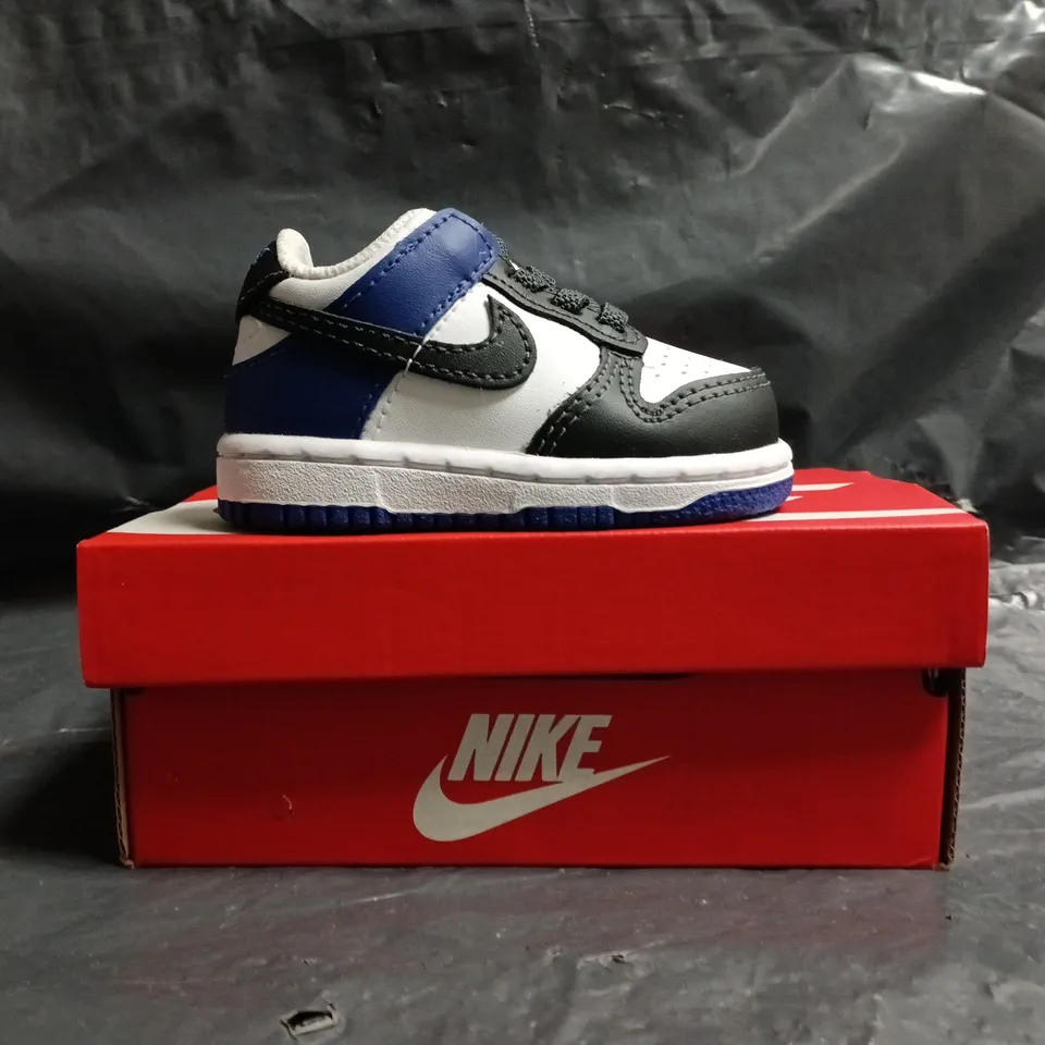 BOXED PAIR OF NIKE DUNK LOW INFANT TRAINERS IN WHITE/BLACK/BLUE SIZE UK 2.5