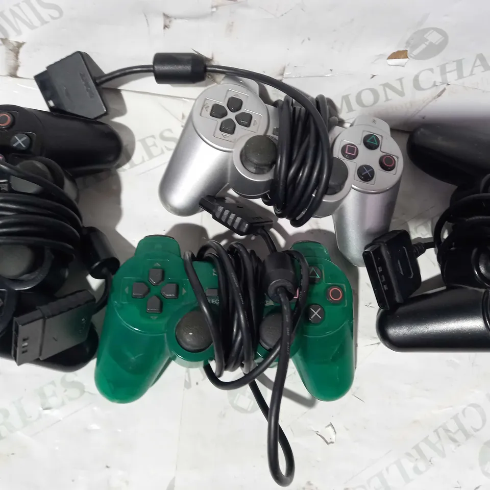 BOX OF ASSORTED SONY PLAYSTATION WIRED CONTROLLERS IN VARIOUS COLOURS