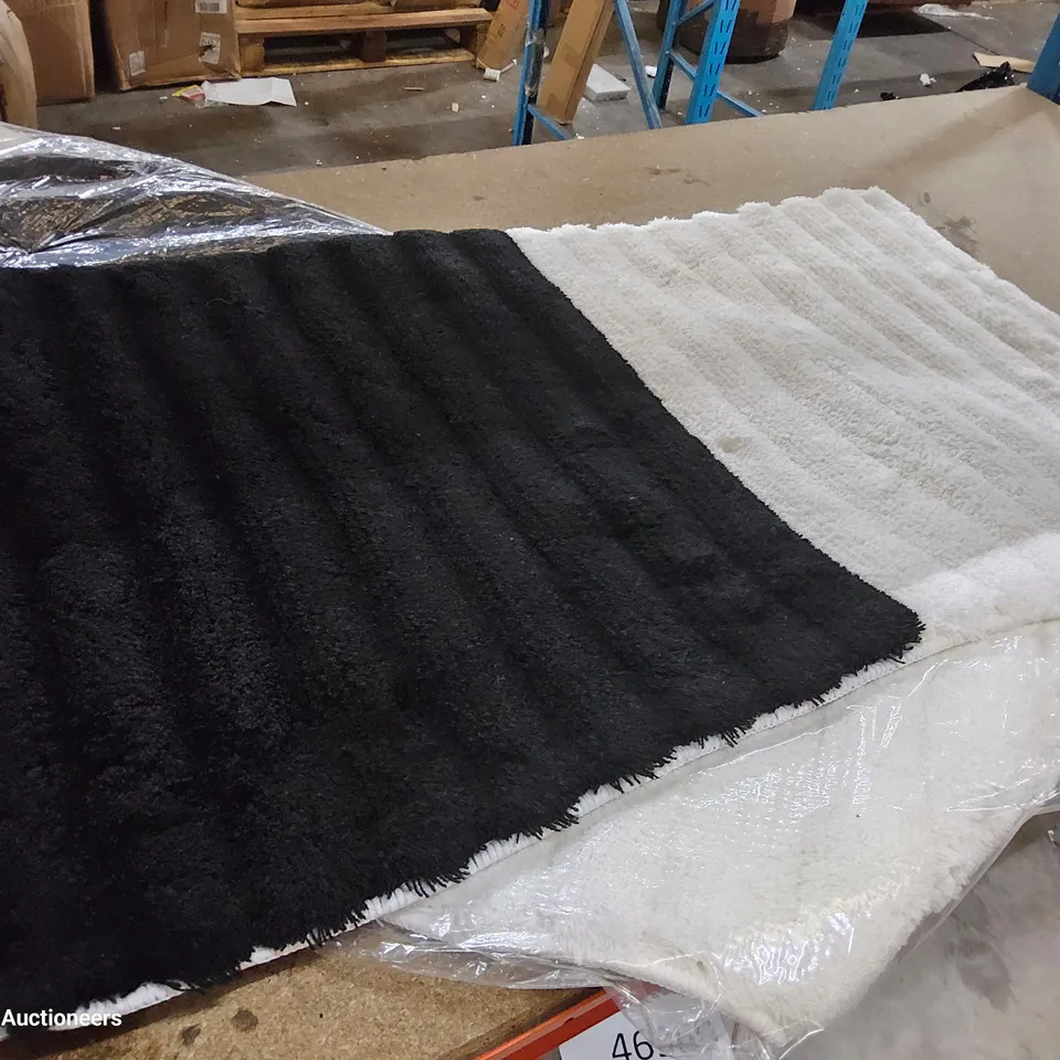 TWO DESIGNER SOFT BLACK/WHITE BATH MATS