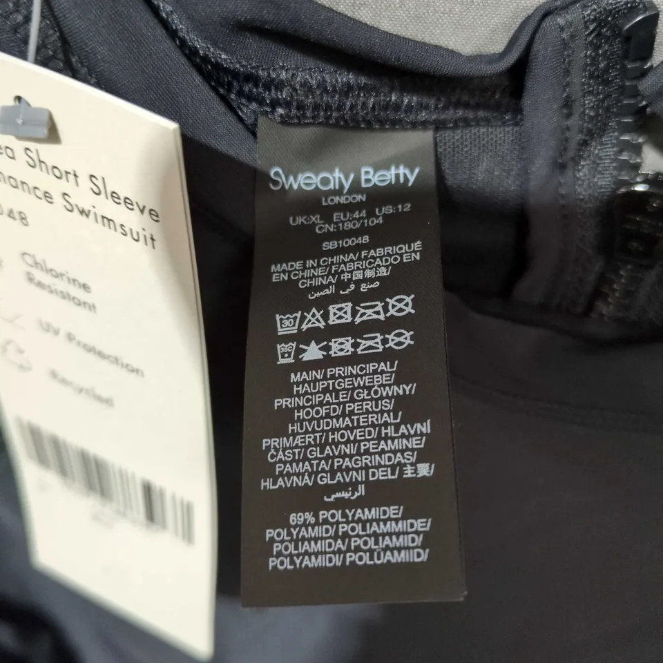 SWEATY BETTY DEEP SEA SHORT SLEEVE PERFORMANCE SWIMSUIT, BLACK – UK 16 (EU 44, US 12)