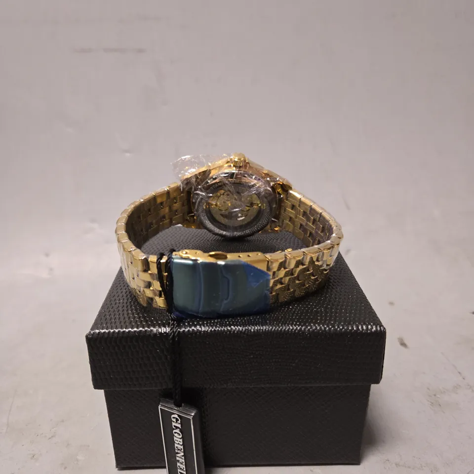 BOXED GLOBENFELD FRAMEWORK WATCH IN AUTOMATIC GOLD