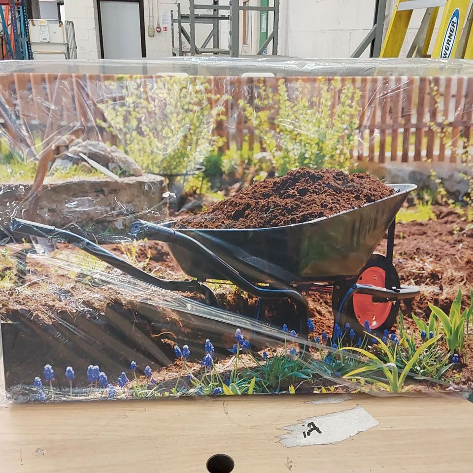 BAGGED WHEELBARROW IN A GARDEN PAINTING BY NOBILIOR (1 BOX)