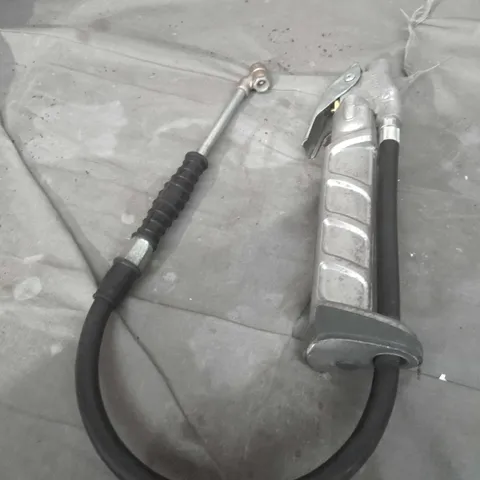 Manual hand pump with hose and inflator nozzle