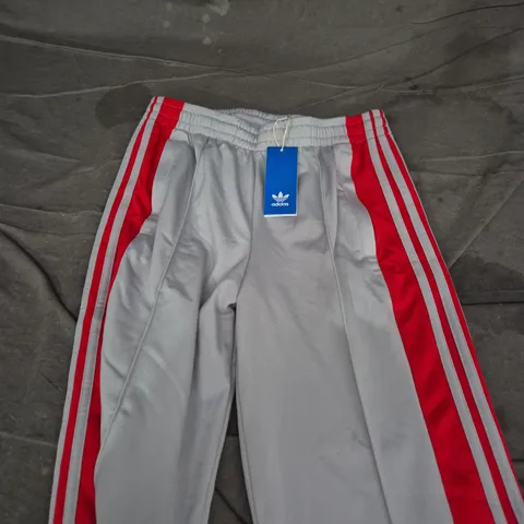 ADIDAS GREY TRACKSUIT BOTTOMS WITH RED SIDE STRIPES – UK XS