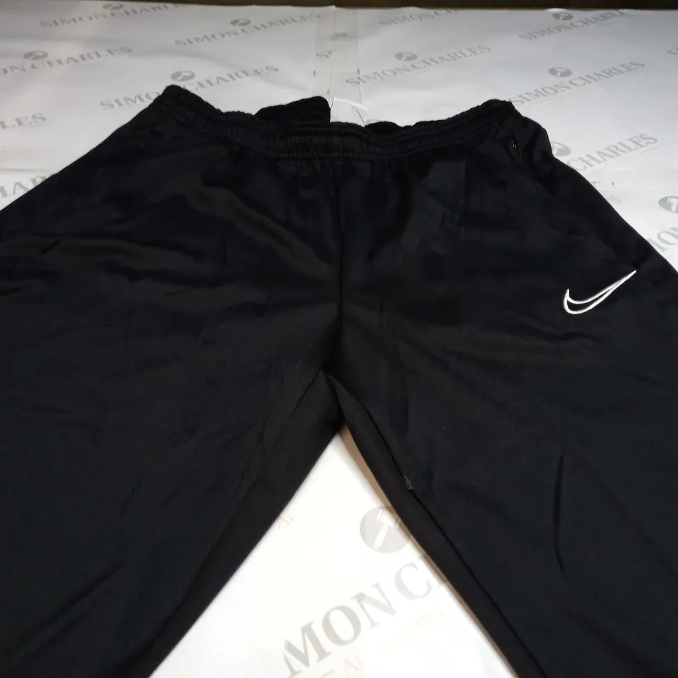 NIKE ACADEMY PANTS IN BLACK - SIZE 12 (M)