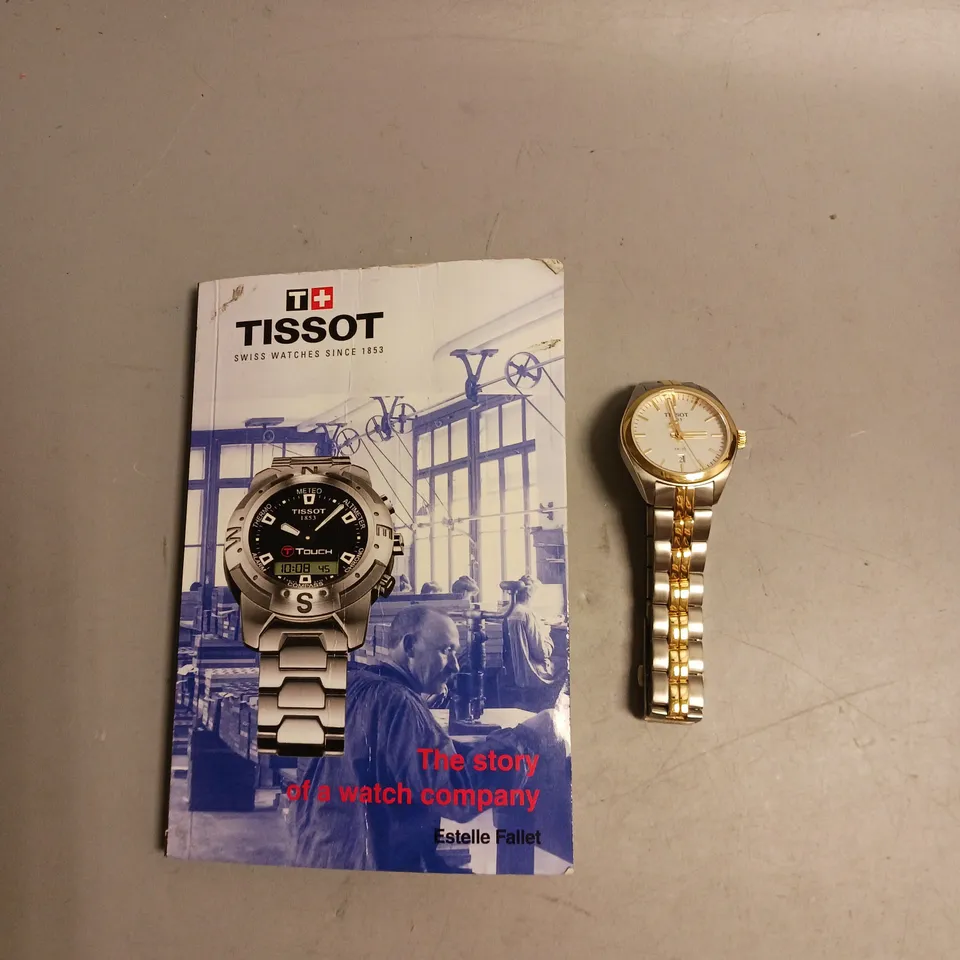 TISSOT WATCH IN GOLD AND SILVER INCLUDES BOOK THE STORY OF A WATCH COMPANY BY ESTELLER FALLET