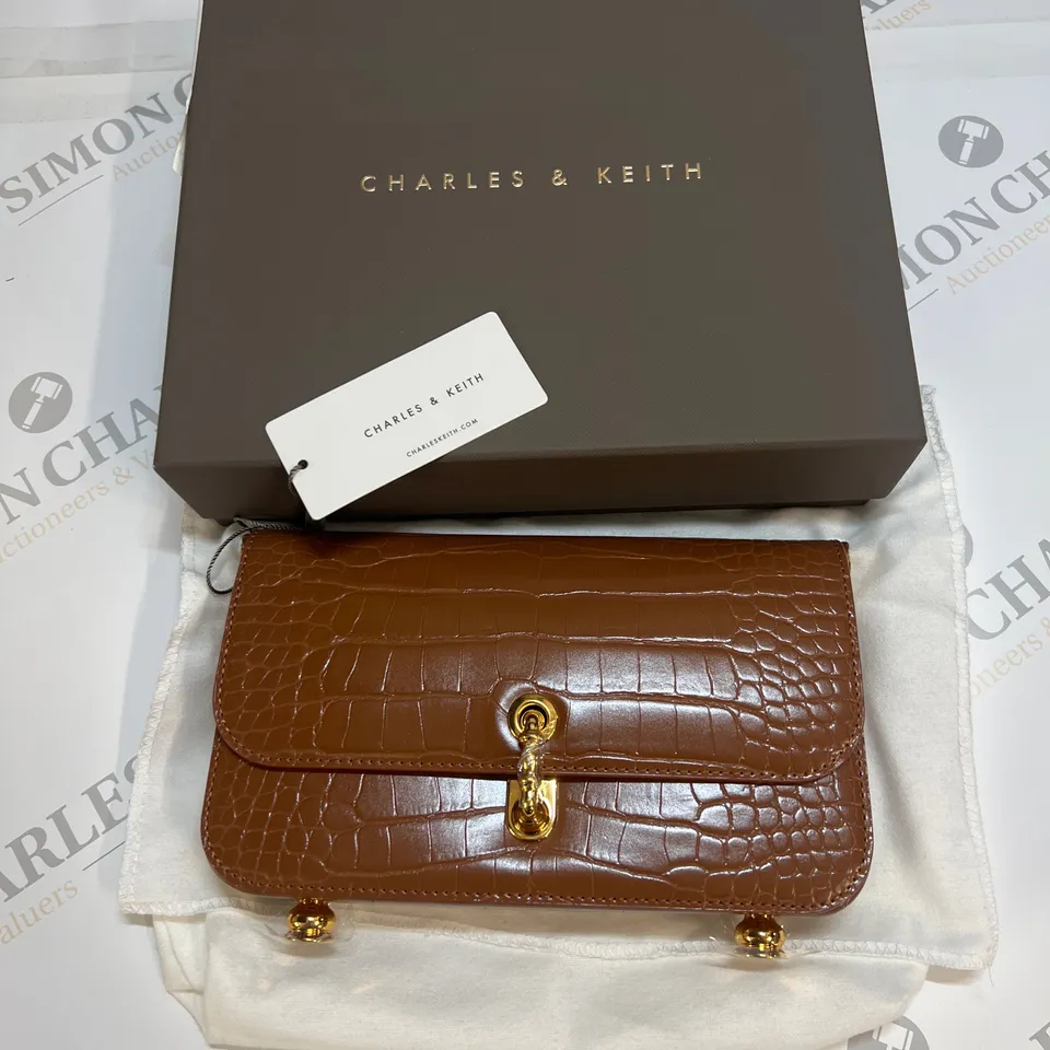 CHARLES & KEITH MERIAH CROC-EMBOSSED CLUTCH BAG IN CHOCOLATE SIZE S