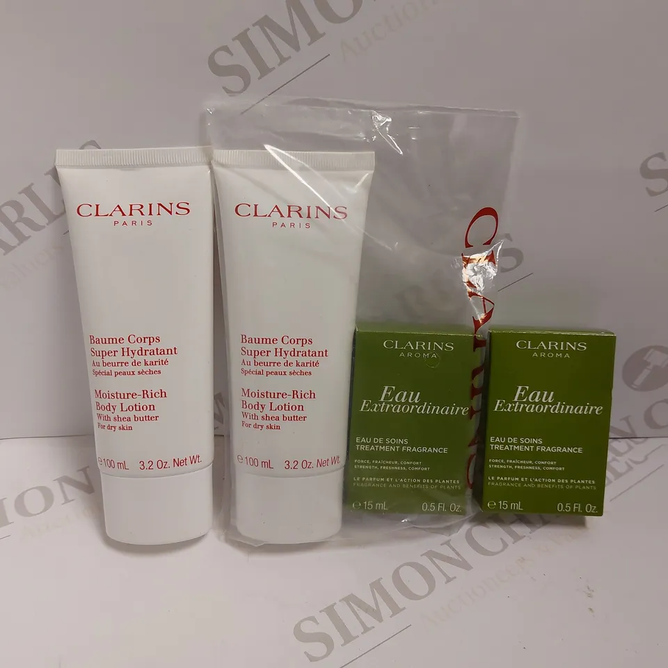 BOX OF 4 CLARINS ITEMS TO INCLUDE BODY LOTION AND TREATMENT FRAGRANCE