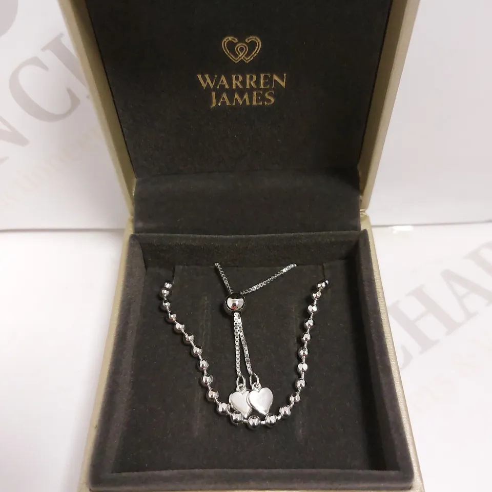 BOXED WARREN JAMES SILVER BRACELET WITH HEART DETAIL