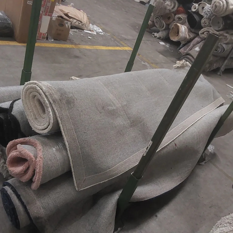 STILLAGE CONTAINING 6x DAMAGED DESIGNER RUGS