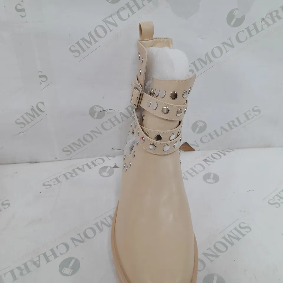 PAIR OF GIRLHOOD BUCKLE EMBELISHED BOOTS IN CREAM - SIZE 40