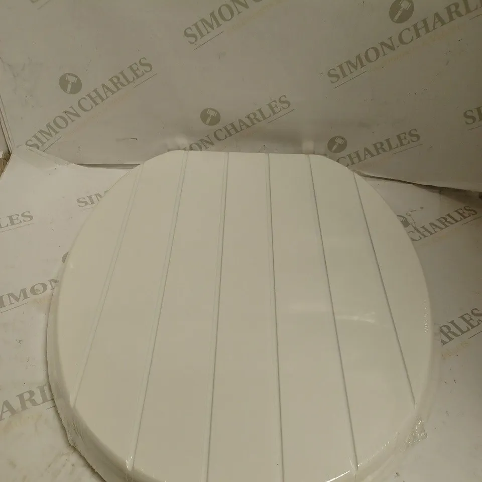 BOXED AND SEALED MDF TOILET SEAT. 