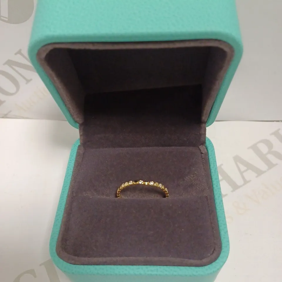 NORM GOLD EFFECT LOOP RING WITH STONES